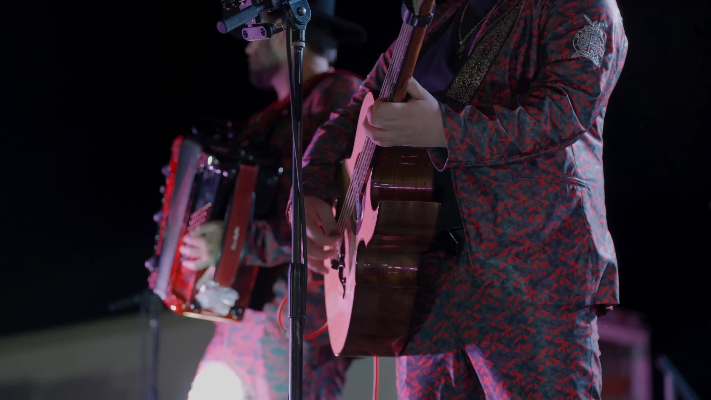 Close view of accordion and guitar during a live jaripeo performance
