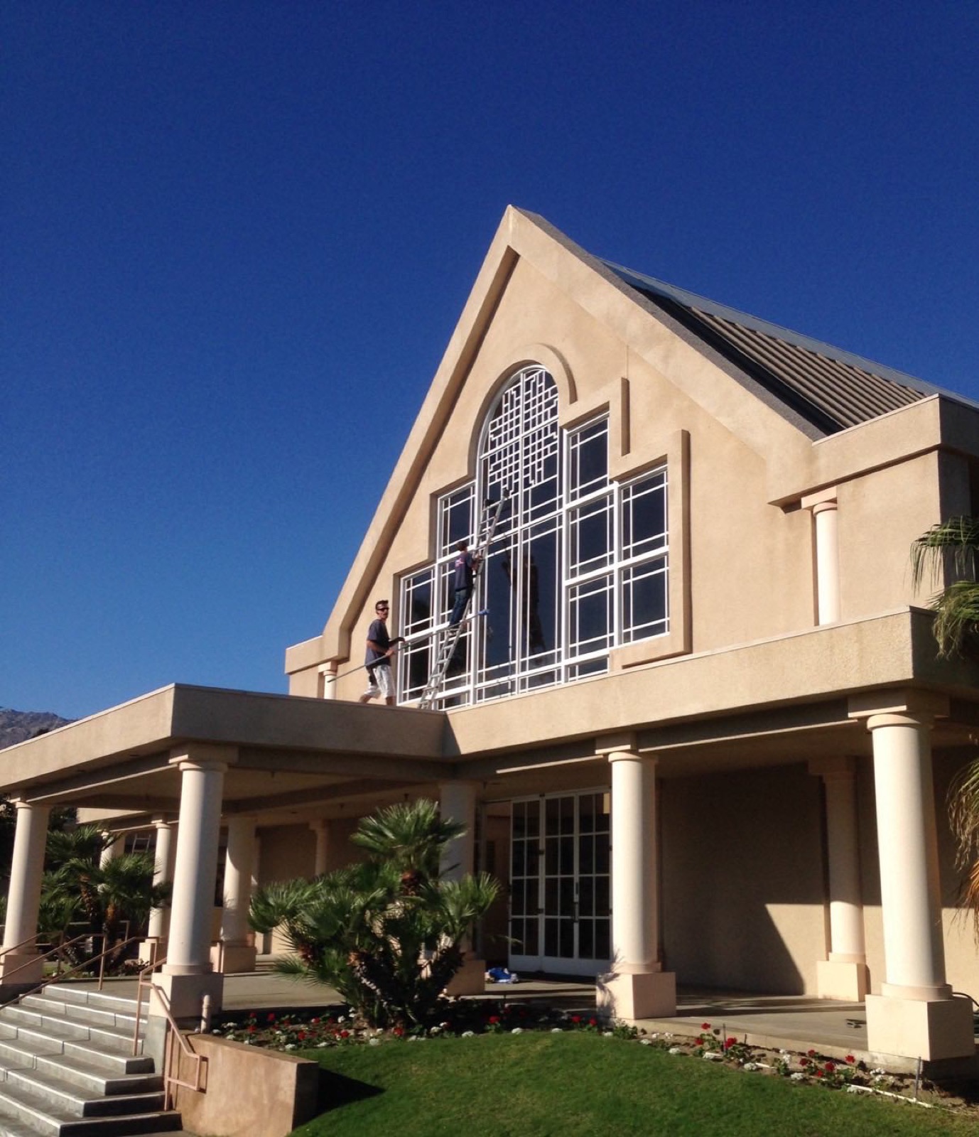 Palm Desert Window Cleaning crew cleaning commercial storefront glass in the Coachella Valley