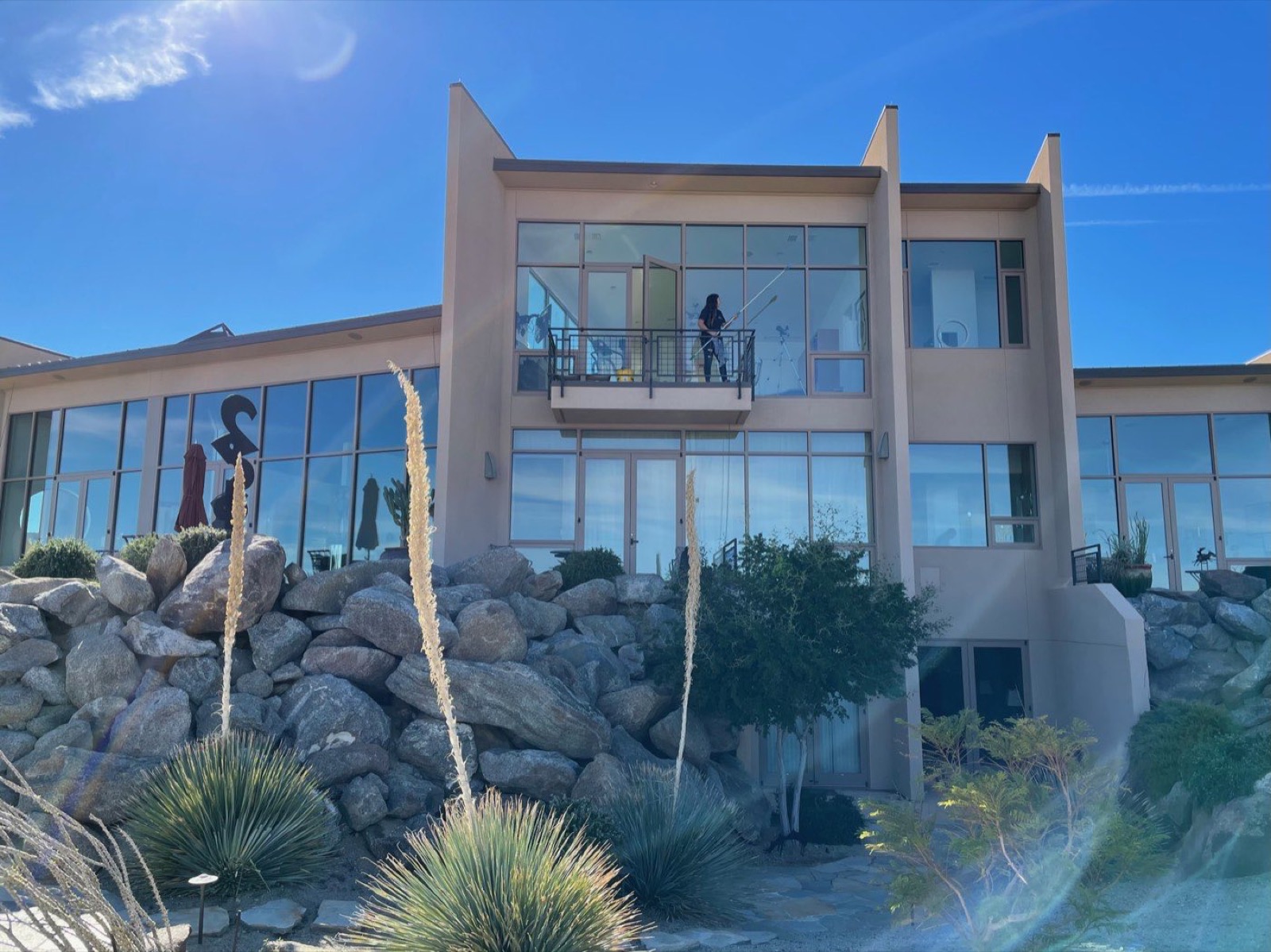 Freshly cleaned floor-to-ceiling windows on a desert estate home serviced by Palm Desert Window Cleaning in the Coachella Valley