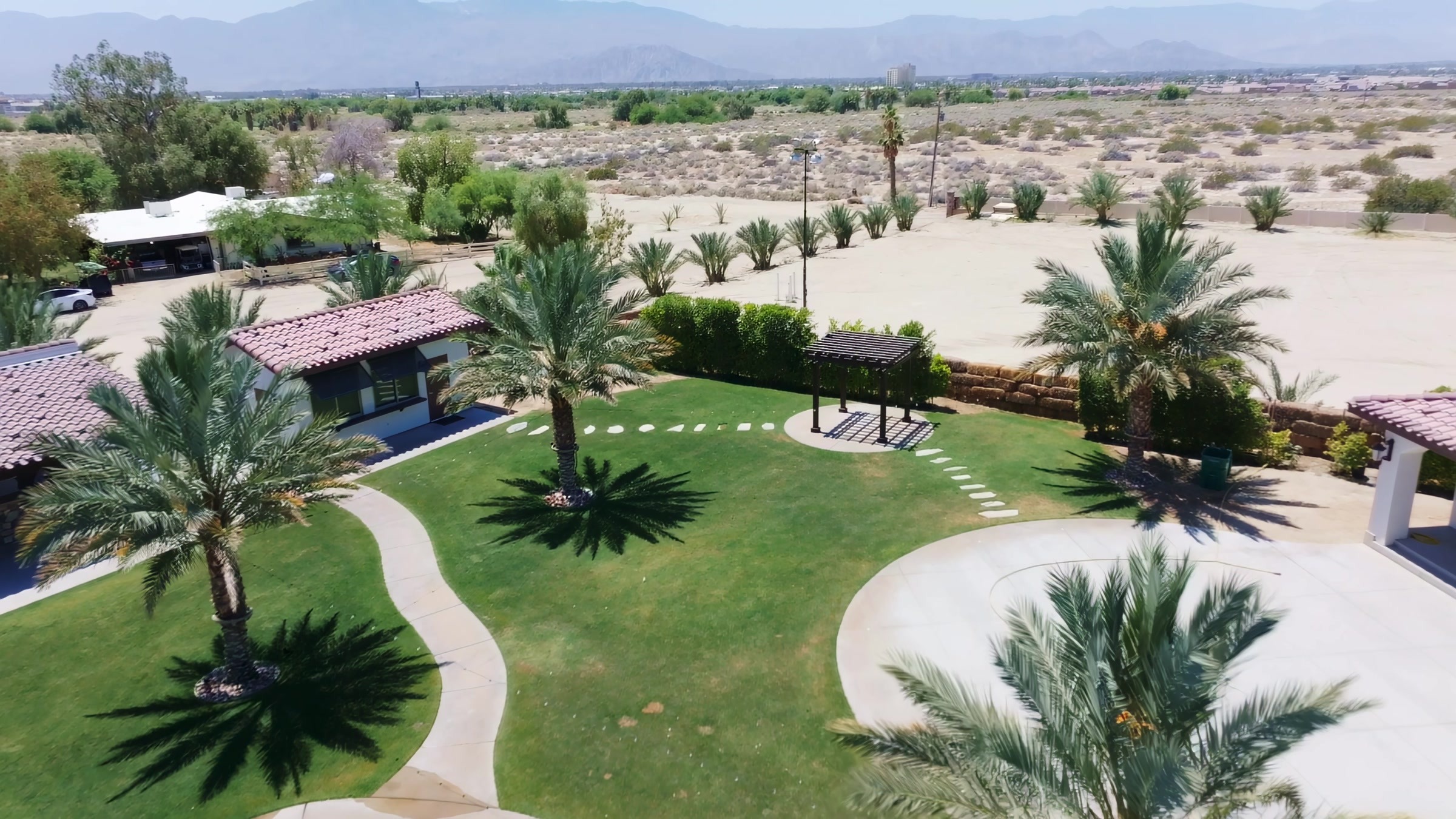 Rancho Escondido courtyard ceremony space with fountain and aisle, aerial view