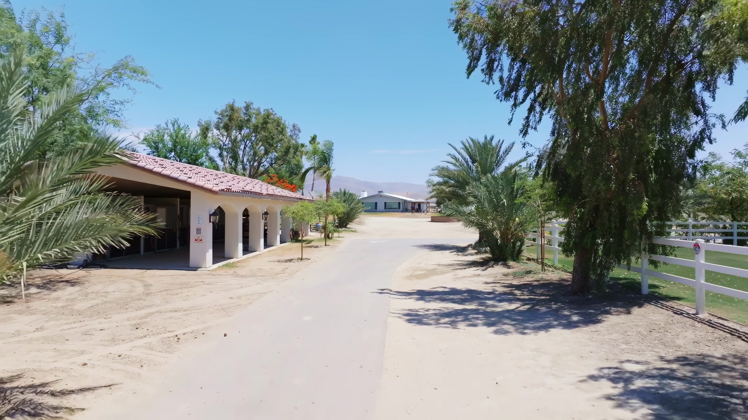 Rancho Escondido entrance driveway with desert mountains in background