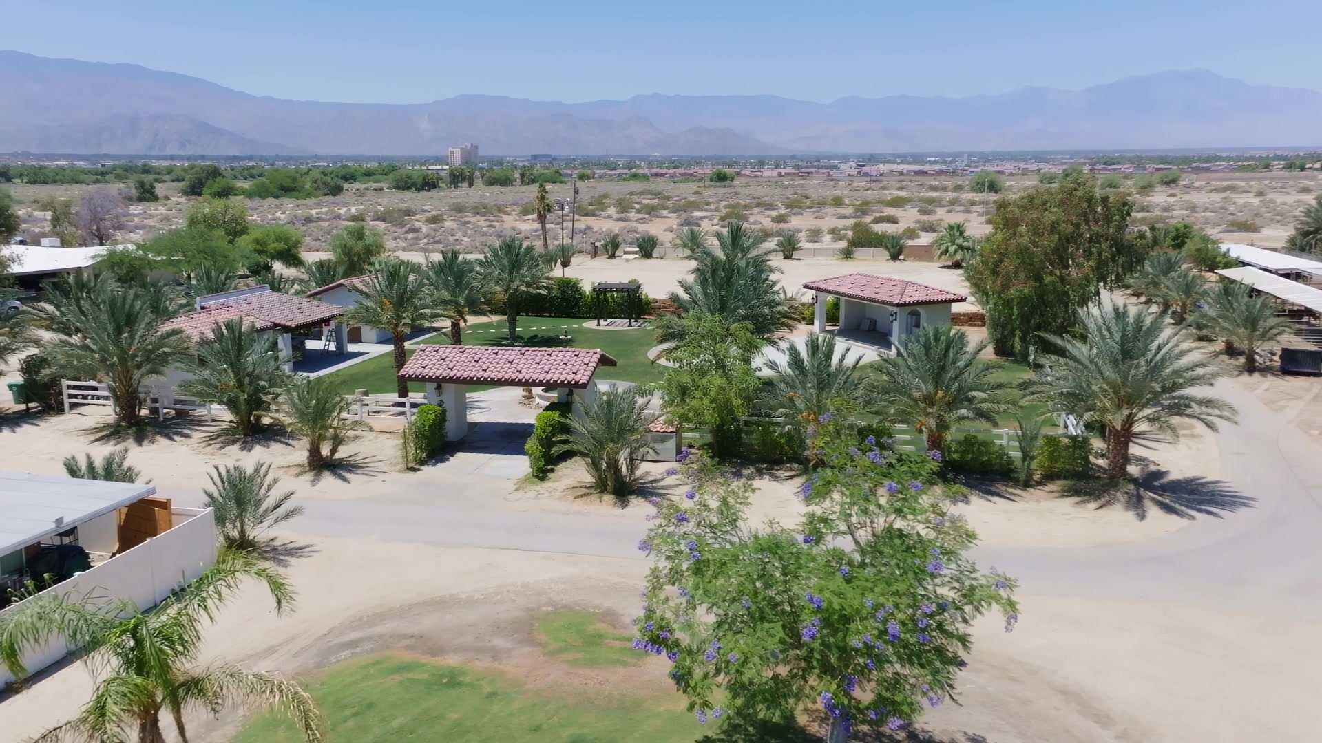 Still from the Rancho Escondido drone hero film, property aerial at golden hour